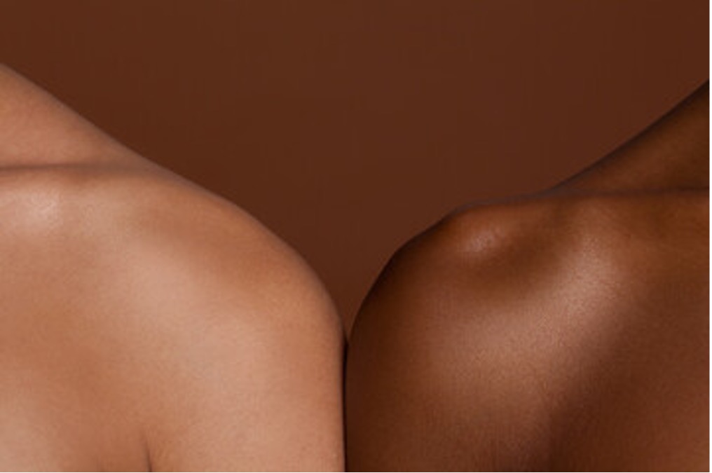 Diversity in research. Two shoulders with different skin tones side by side.